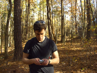 Peter texting in the woods.JPG