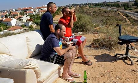 Israelis lounge as Gaza is bombed.JPG