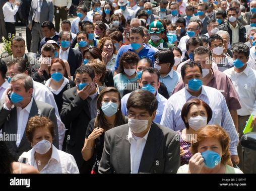 people-wearing-masks-gather-outside-buildings-after-an-earthquake-C1DTHT.jpg