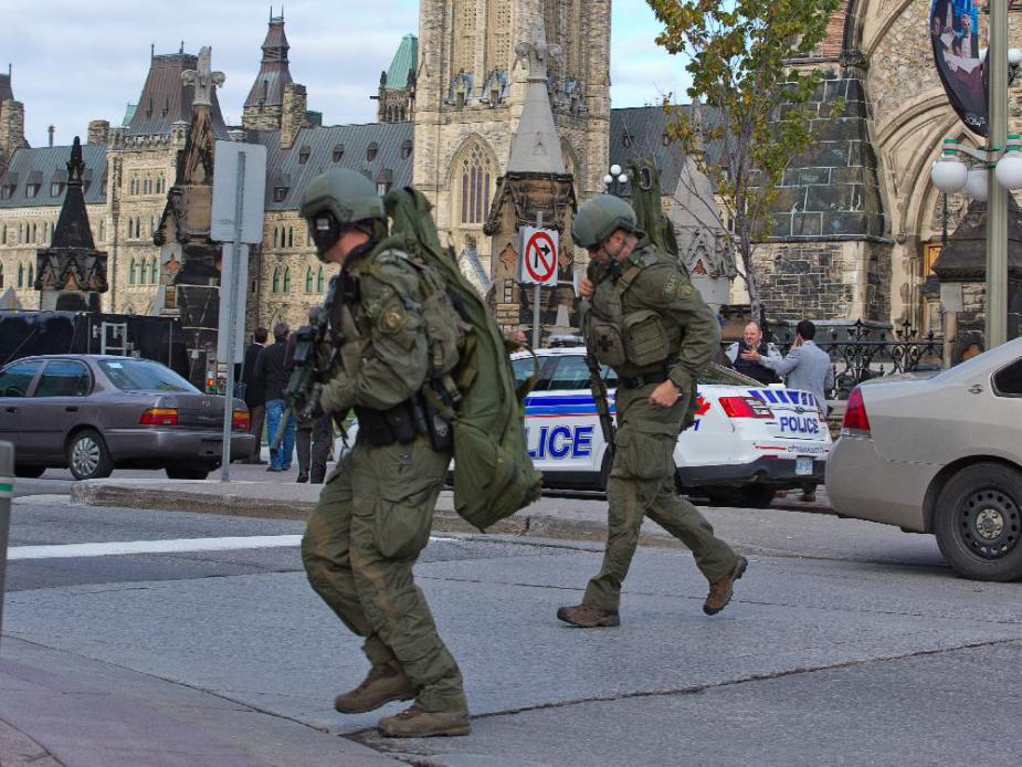 rcmp-tactical-officers-cross-the-road-heading-towards-the-la.jpg