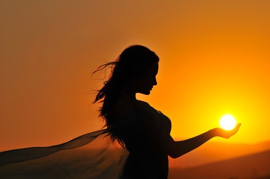 woman-sunset-sunrise-silhouette-holding-sunball.png